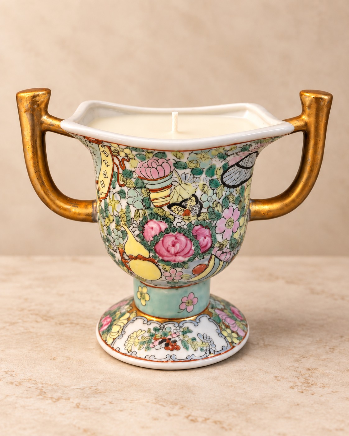 Two-handled floral porcelain urn with gilt detailing