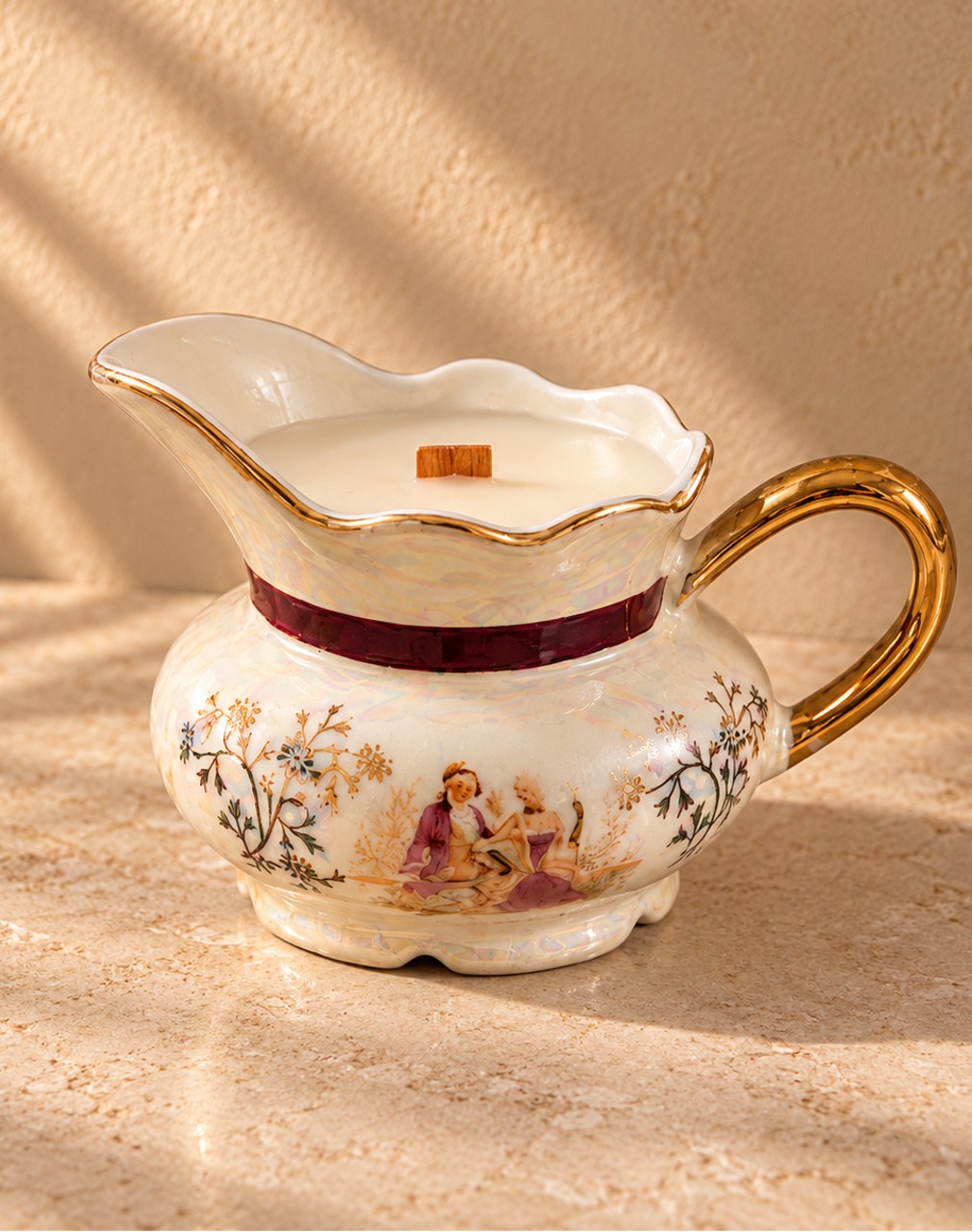 Porcelain creamer with painted romantic scene