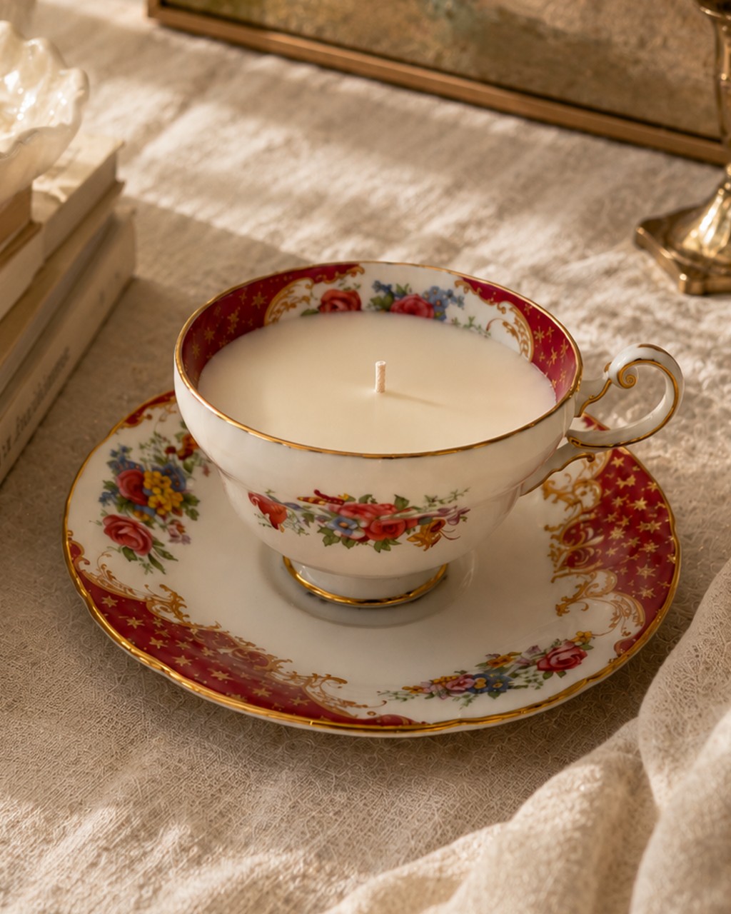 Floral porcelain teacup and saucer with crimson border